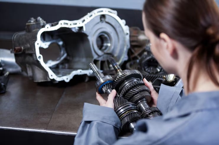 Technician repairing industrial mechanical components