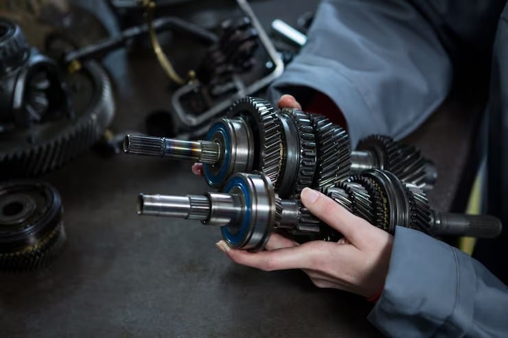 Technician repairing industrial mechanical components